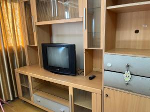 a television sitting on a desk in a closet at Impact Arena C4 by Jintana in Ban Bang Phang +13 photos