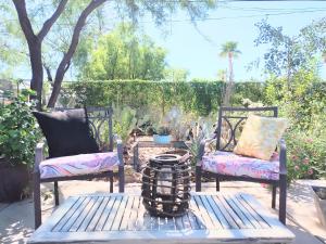 a patio with two chairs and a table at Early Birds in Tucson +6 photos