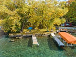 an aerial view of a dock in a lake at Heron Cottage on Cayuga Lake in Aurora