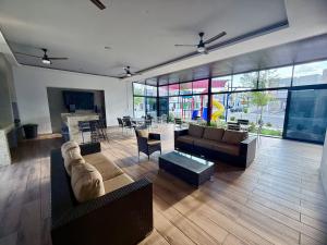 a living room with couches and chairs and a table at Casa Marsella 2 Privada y Moderna in Zaragoza