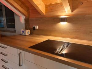 a kitchen with a counter top with a stove at Bordinghouse Arndt in Memmingen