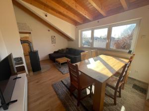 a living room with a table and a couch at Bordinghouse Arndt in Memmingen