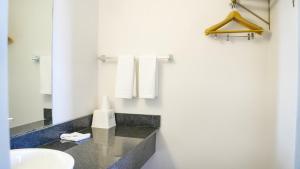a bathroom with a sink and a mirror at Motel 6-Rolla, MO in Rolla +17 photos