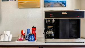 a coffee maker sitting on top of a counter at Motel 6-Rolla, MO in Rolla