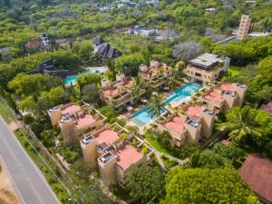 an aerial view of a mansion with a swimming pool at Villa Mandhari - Diani Beach in Diani Beach