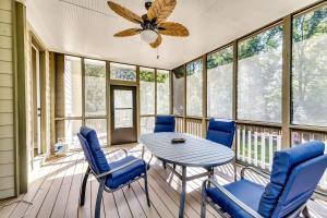 a screened in porch with a table and chairs at 6BD55B,BrookhavenSleeps 12,Big yard,w poolGate in Atlanta