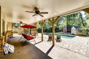 a patio with a ceiling fan and a pool at 6BD55B,BrookhavenSleeps 12,Big yard,w poolGate in Atlanta