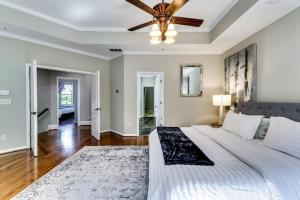 a bedroom with a large bed with a ceiling fan at 6BD55B,BrookhavenSleeps 12,Big yard,w poolGate in Atlanta +34 photos