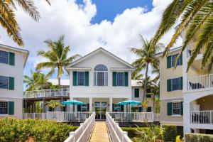 a view of the front of a house with palm trees at Hyatt Vacation Club at Windward Pointe in Key West