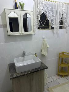 a bathroom with a sink and a mirror at Highway Haven in Stilfontein