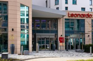 a building with a sign that reads lenovo at Leonardo Hotel Eschborn Frankfurt in Eschborn