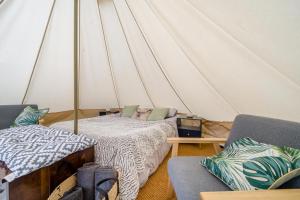 a tent with a bed and two couches in a room at 1 Bed in Austwick oc-r32793 in Eldroth