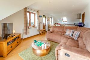 a living room with a couch and a tv at 3 Bed in Marazion oc-m30668 in Marazion
