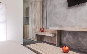 an apple sitting on a wooden shelf in a room at Lena Apartments Potos Thassos in Potos
