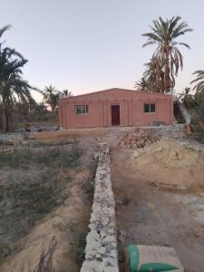 a house is being built in a field at Villa Rumi Siwa in Damshīt