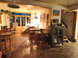 a room with a table and chairs and a dining room at Posada la Piedra in Constitución