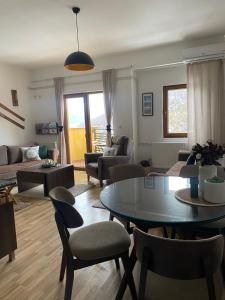 a living room with a table and chairs at Moun2 in Mavrovo