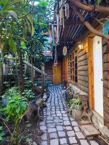 a walkway outside of a house with a building at Posada la Piedra in Constitución