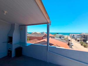 a balcony with a view of the ocean at Rooftop BeiraMar in Balneario Barra do Sul