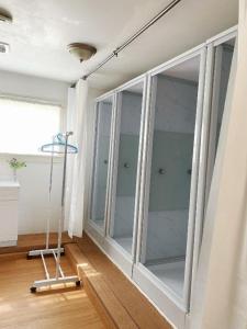 a room with a large glass window in a room at EcoSun Hostel in Montague +59 photos