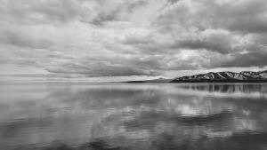a black and white photo of a large body of water at Sevan lake view in Tsovagyugh +3 photos