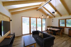 a living room with a couch and a table at Ferienhaus Strohschneider in Hermagor