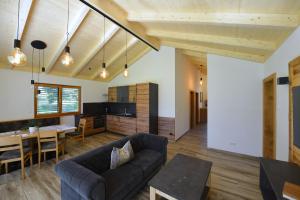 a living room with a couch and a table at Ferienhaus Strohschneider in Hermagor