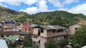 a view of a town with a mountain at Zanotti's House in Santa Teresa