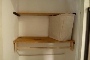 a paper bag sitting on a shelf in a closet at Amalfi Surf Lodge in ChiltiupÃ¡n