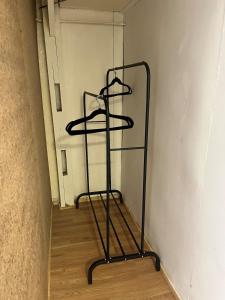 a black shelf in a room with a wall at Central Apartment in Cochrane