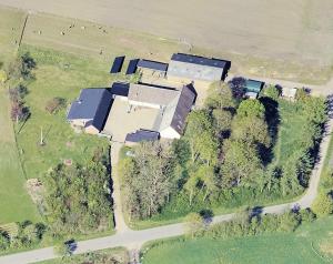 an aerial view of a large house with trees at Hyrdeskolen in Give