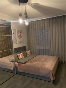 a bedroom with a bed and a glass wall at CentralPark in Kostrzyn nad Odrą