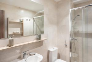 a bathroom with a shower and a toilet and a sink at Stephouse Girona Tarradellas in Girona +9 photos