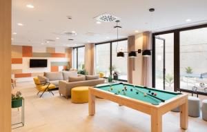 a living room with a pool table at Stephouse Girona Tarradellas in Girona