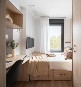 a bedroom with a bed and a window at Stephouse Girona Tarradellas in Girona