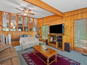 a living room with a couch and a tv at Clear Creek Escape - Double Decker Dock, New Green Fishing Lights! in Jasper +32 photos