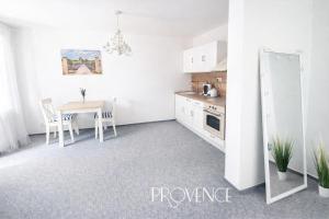 a kitchen with a table and a dining room at The Meetinka - Peaceful Stay, Jeseníky in Jeseník +5 photos