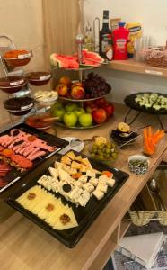 a table with many different types of food on it at Meridian Hotel in Budva