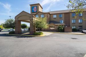 a hotel with a sign on the front of it at Motel 6-Indianapolis, IN - Airport in Indianapolis