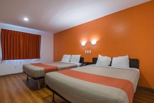 a hotel room with two beds and a window at Motel 6-Marshalltown, IA in Marshalltown