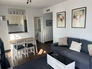 a living room with a couch and a table at over the sea in El Morche