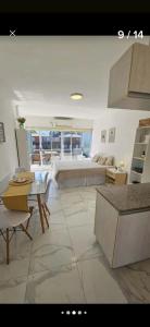 a living room with a couch and a table at Apartamentos del campus in Manzone
