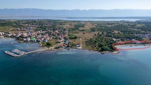 an aerial view of a small island in the water at Villa Privlaka Travertino in Privlaka +21 photos