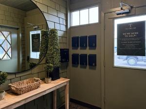 a waiting room with a mirror and a door at The Trail Inn - Grantsburg, WI - 703 WI-70 in Grantsburg +20 photos