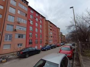 a row of cars parked in front of buildings at SWEET APT Zenica in Zenica