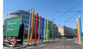 a row of colorful flags on the side of a street at Geneve Gaillard studio in Gaillard