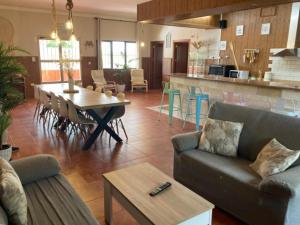 a living room with a couch and a table at Casa Rural Kentia in Valdepeñas
