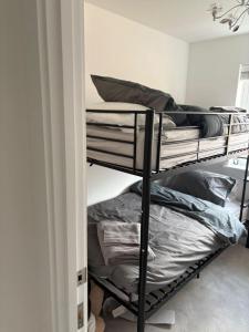 a room with two bunk beds with pillows at 3,Lime Tree Ave in Haverfordwest