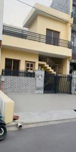 a house with a truck parked in front of it at 2bhk corporate home in Sohāna
