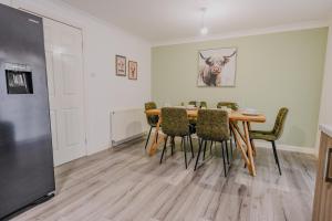 a dining room with a table and chairs at Dunward House in Livingston